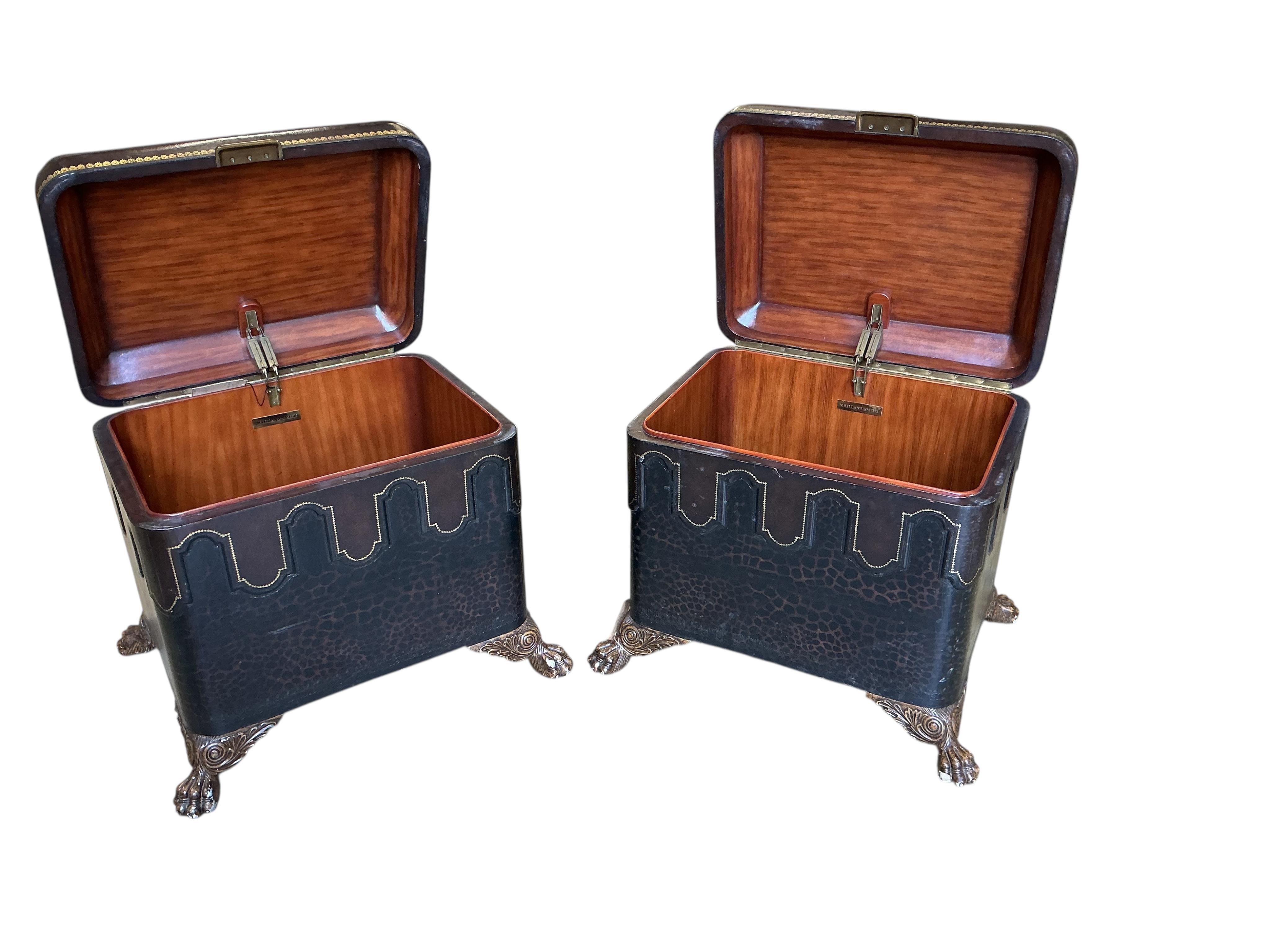 A pair of Contemporary Maitland Smith leather covered, leopard print trunks on lions paw feet, width 74cm, depth 58cm, height 60cm